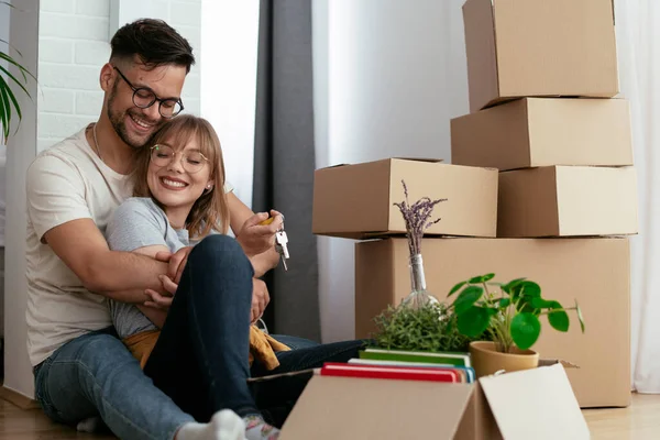 Boyfriend and girlfriend are moving in a apartment.