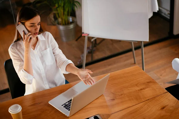 businesswoman working in office at night