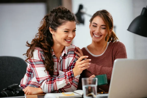 Businesswomen working on a new project. Colleges discussing about problem they have to solved.