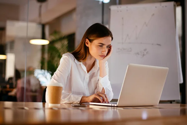 woman working in office at night