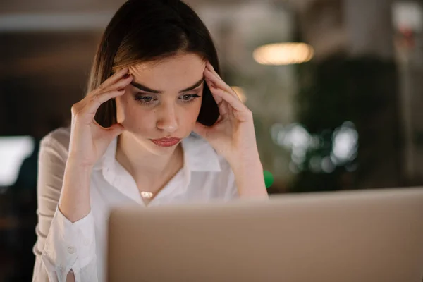 woman working in office at night