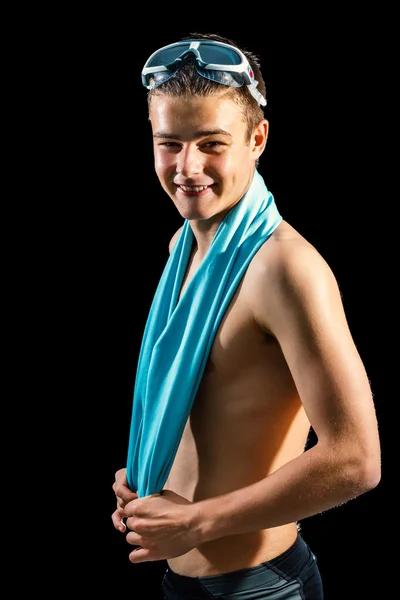 Handsome teen swimmer against black background. — Stock Photo, Image