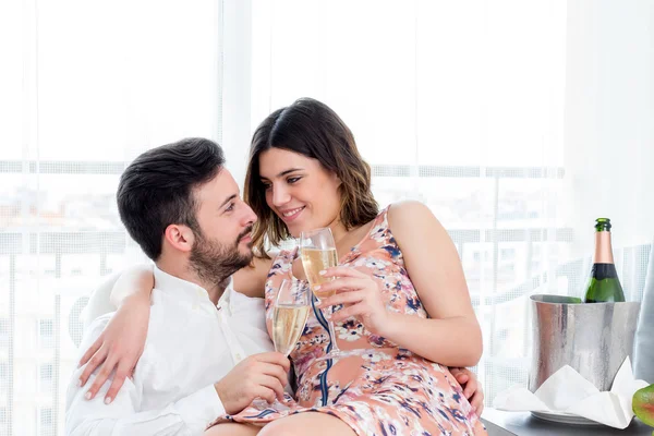 Couple celebrating weekend getaway in hotel. — Stock Photo, Image