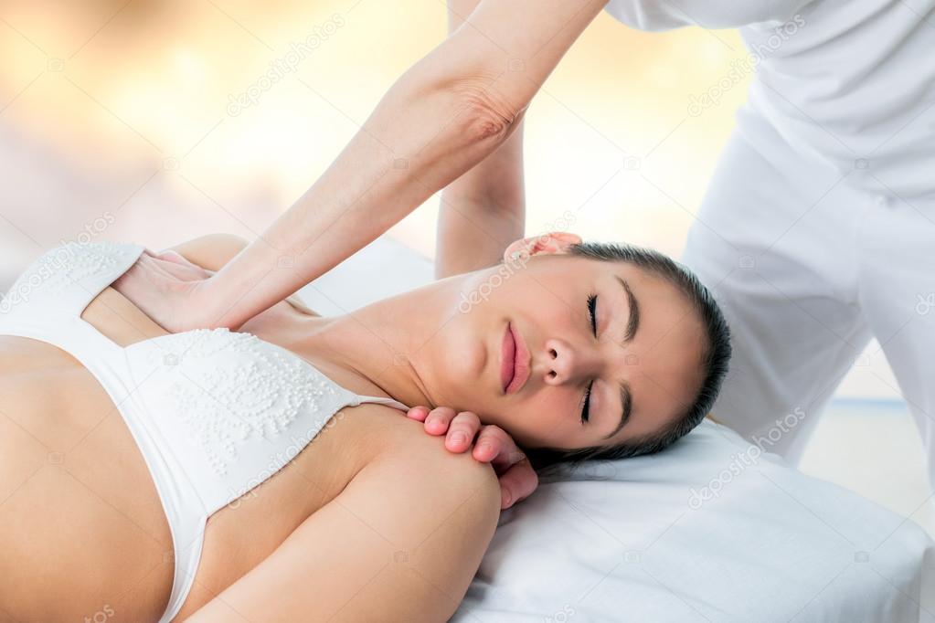 Osteopath applying pressure on female chest. Stock Photo by ©karelnoppe  112688552