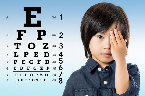 Asian kid reviewing eyesight.