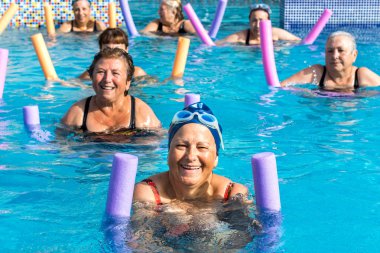 Group of senior citizens doing aqua gym.t clipart