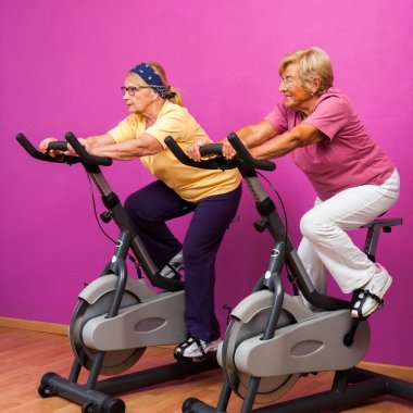 Senior ladies at spinning session. clipart