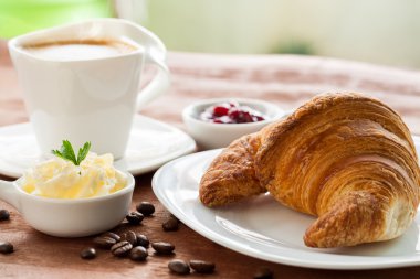 Croissant with coffee. clipart