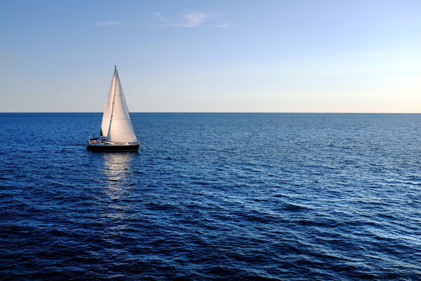 Sail boat on open sea.