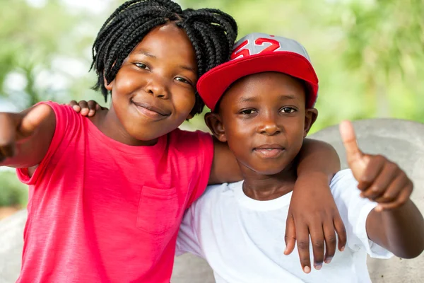 African brother and sister doing thumbs up. — Stock Photo, Image