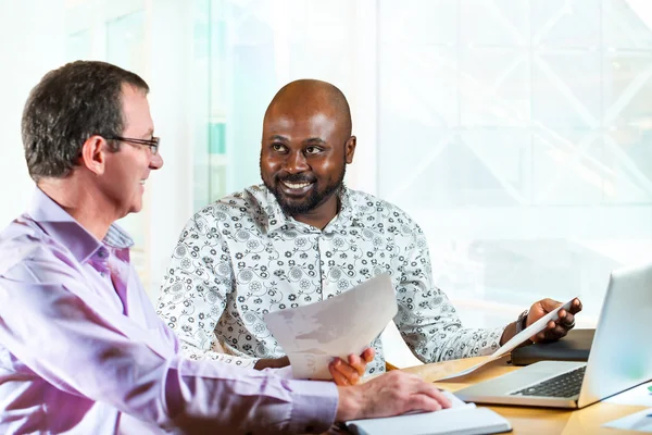 Diverse business partners at desk. — Stock Photo, Image