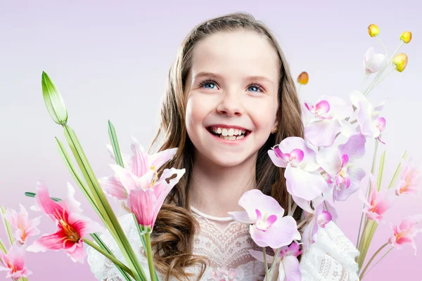 Fun portrait of girl with flowers. — Stock Photo, Image
