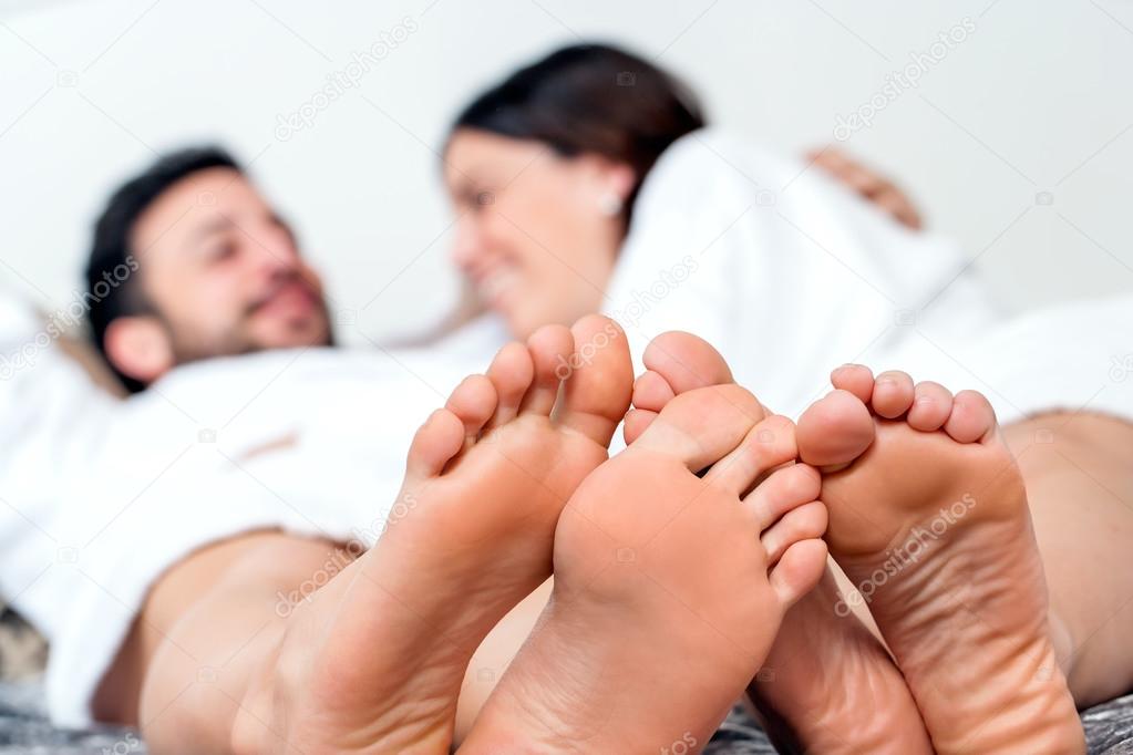 Detail of feet with couple in background.