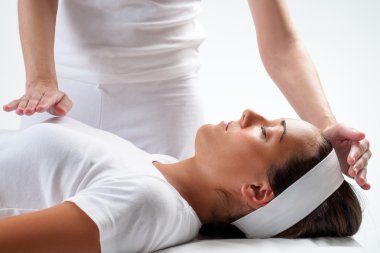 Woman at reiki session. clipart