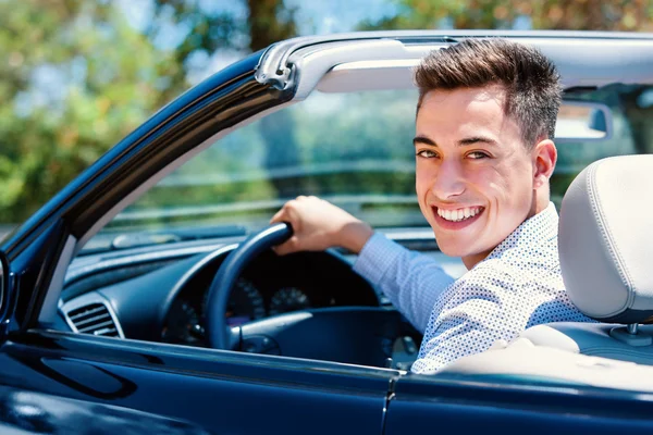 Young man sitting in car. — Stock Photo, Image