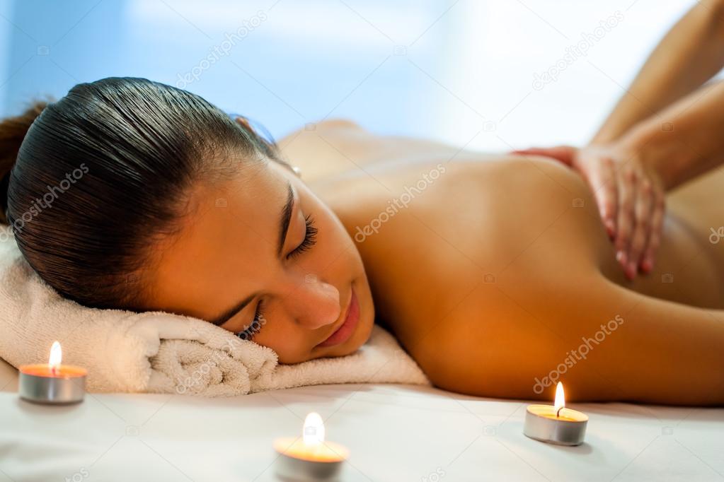 woman having relaxing body spa treatment