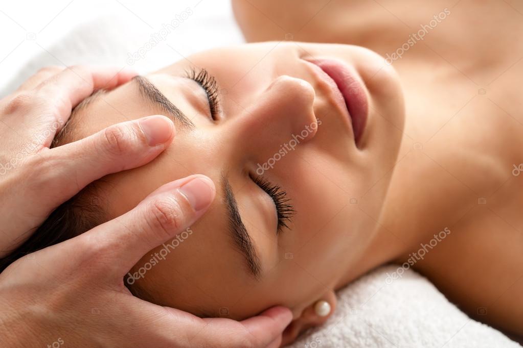 woman having curative facial massage