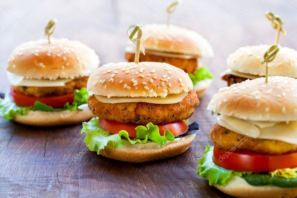 Appetizing mini chicken burgers. — Stock Photo © karelnoppe 88192758