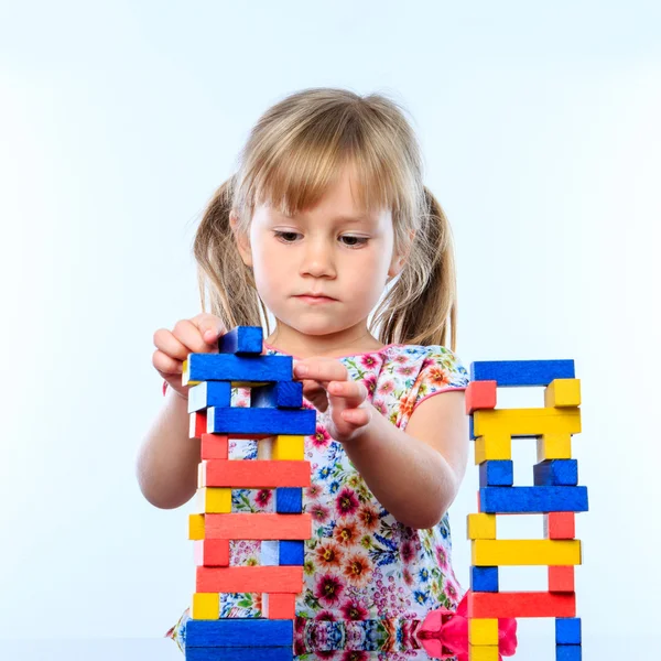 Girl building structure with blocks Royalty Free Stock Images