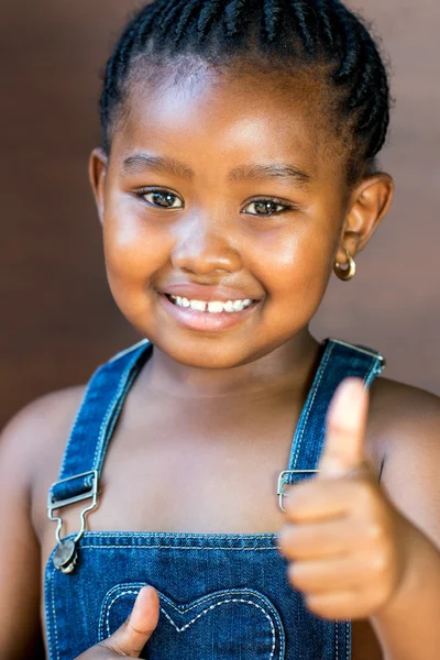 Cute afro american girl doing thumbs up Royalty Free Stock Photos