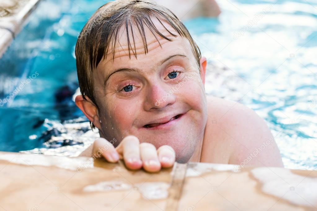 Handicapped boy in swimming pool.