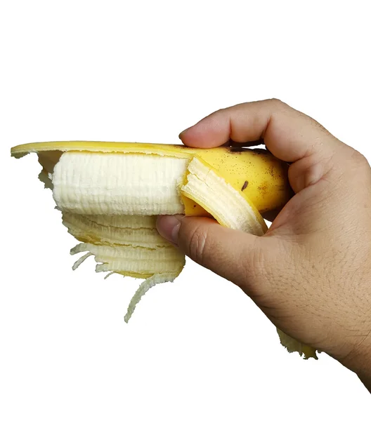 Męskiej ręki trzymającej Banana jest podjąć ukąszenie. — Zdjęcie stockowe