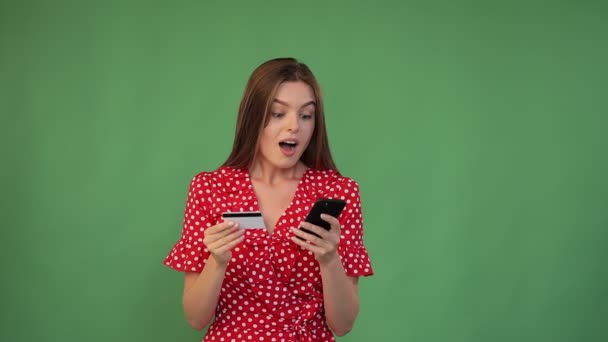 Girl Holds Credit Card Looks Phone Surprised Message She Received — Stock Video