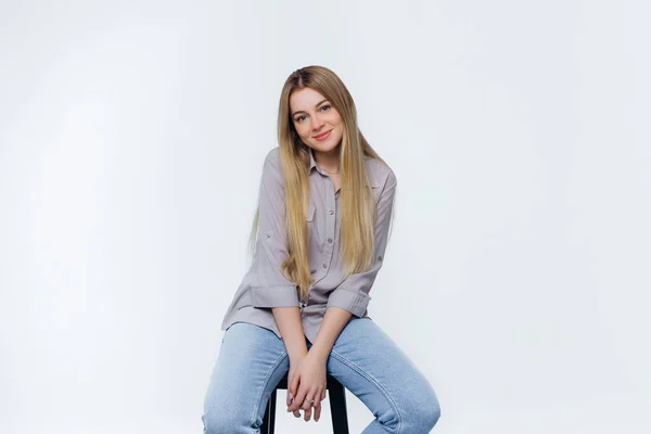 Beautiful Cute Girl Smiling Sits Chair Studio Dressed Jeans Blouse — Stock Photo, Image