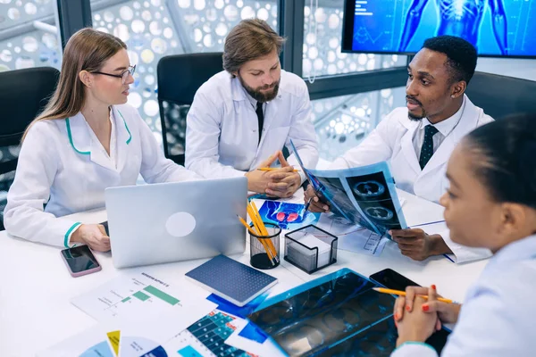 international team of professional doctors having a meeting in conference room at the modern hospital. Healthcare and medical development concept.