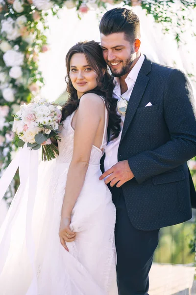 Bride and groom look lovely during the wedding ceremony. wedding couple enjoying romantic moments outside.