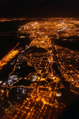 A bird's eye view of Lisbon. The city's attractions. The city lights were photographed from a flying plane. clipart