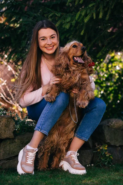 Smiling Young Woman Holding Her Dog Knees Backyard — Stock Photo, Image