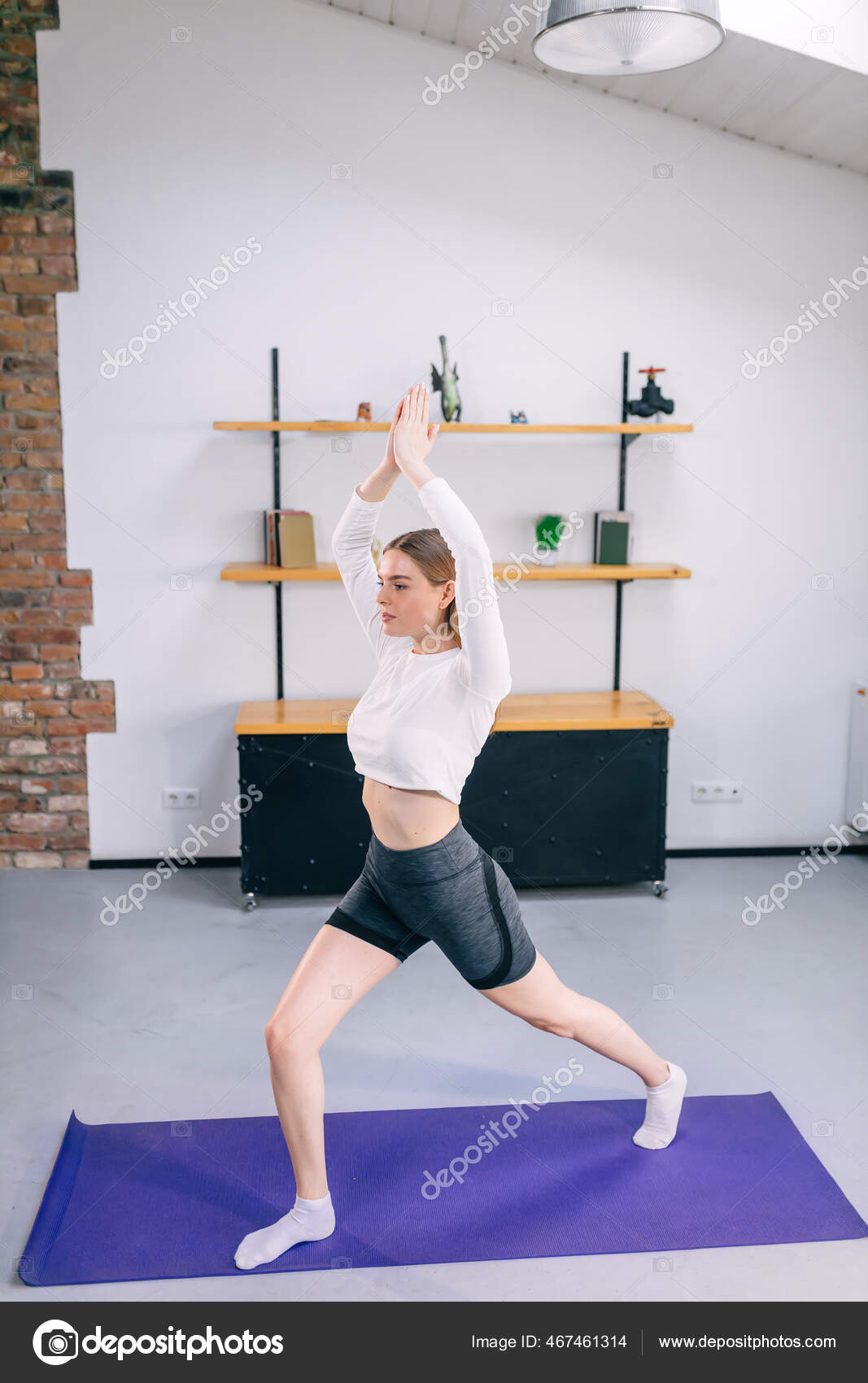Beautiful young atlethic woman wearing sportswear doing yoga
