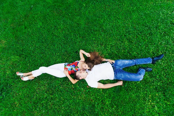 Romantic Couple Lying Green Grass Lawn Hugging Each Other — Foto Stock