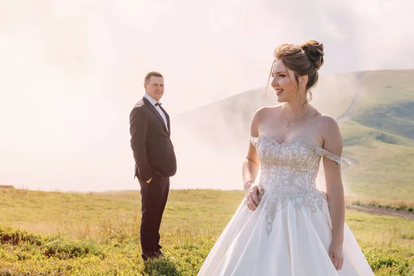 Couple Fair Skinned Newlyweds Standing Wedding Dresses Backdrop Mountains Long — Stock Photo, Image