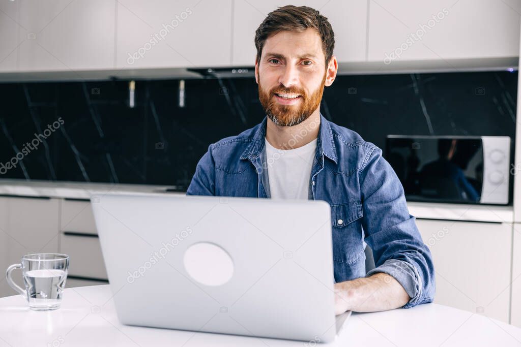 Young happy designer working on laptop from home - freelance concept .