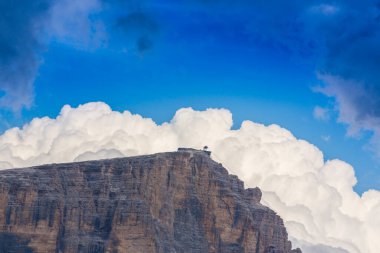 Beautiful cloudscape in the Dolomite mountains in summer