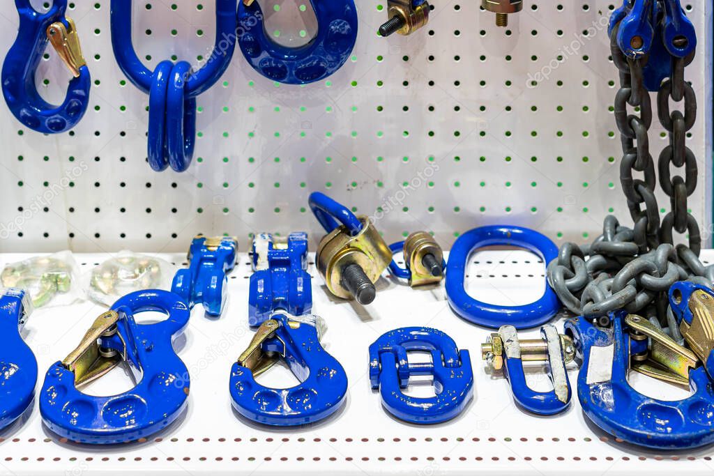 various type of metal or steel lifting hook chain and accessories such as master link shackle screw pin hammerlock connector for hoist crane in industrial place or store on shelf