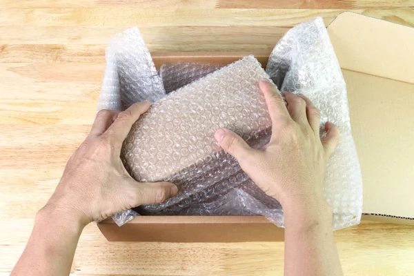 Hand Man Hold Bubbles Covering Box Bubble Wrap Protection Product — Stock Photo, Image