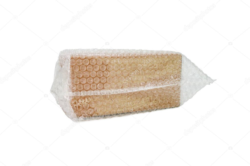 Bubbles covering the box by bubble wrap for protection product cracked isolated white background