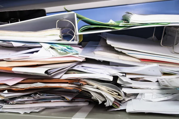 Messy file document and Office Supplies in filing cabinets at work office