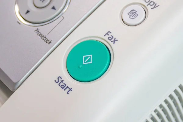 Close up - start button on the fax