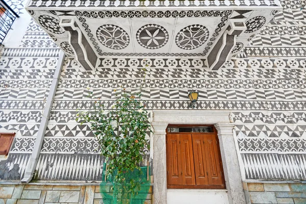 Traditional houses decorated with the famous geometric scratch patterns in the medieval mastic village of Pyrgi on the island of Chios, Greece