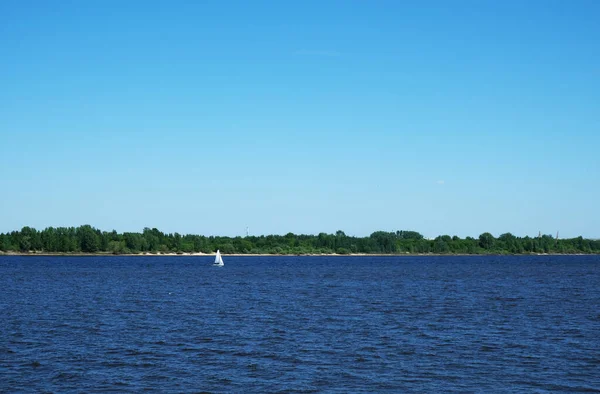 Clear day on the river with small boat — Stock Photo, Image