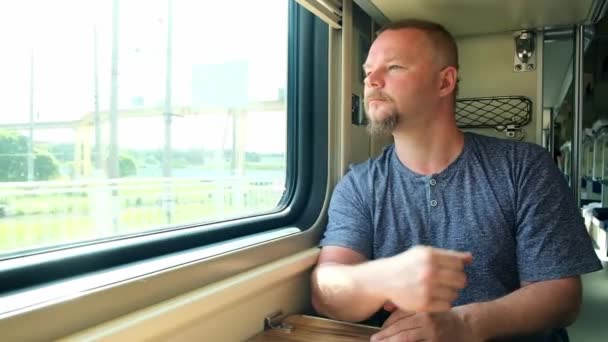 Man has a headache on the train — Stock Video