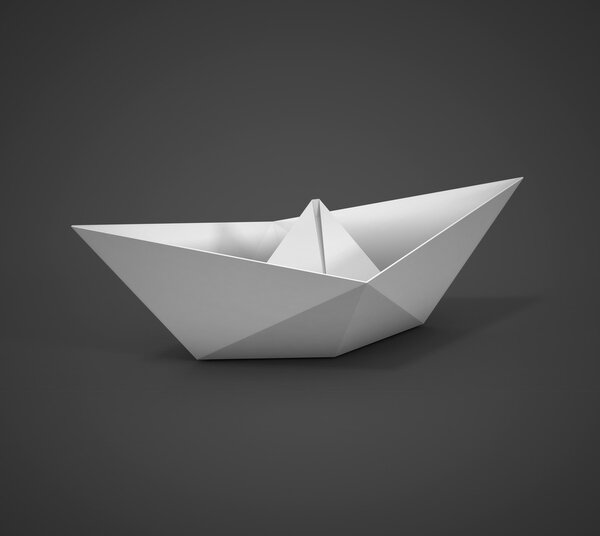 white paper boat on a dark background