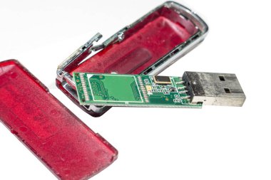 The removable storage cracked isolated on white background,electronics trash concept