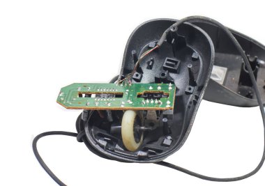 The computer mouse cracked isolated on white background,electronics trash concept