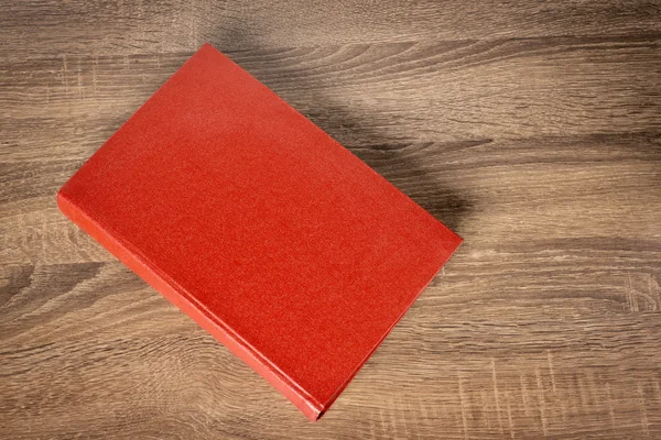 Livro vermelho na mesa — Fotografia de Stock