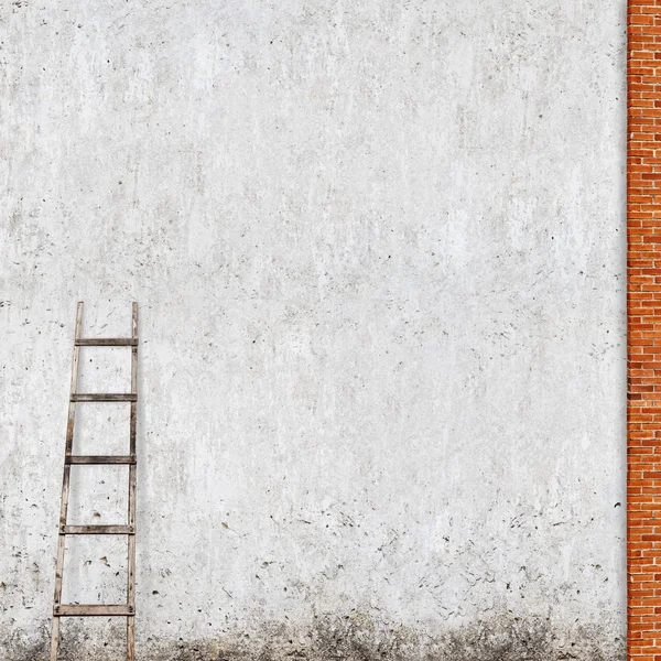 Weathered brick wall with a wooden ladder — Stock Photo, Image